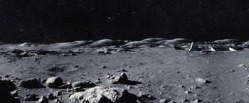 Movie still from “Moon” (2009), directed by Duncan Jones – An image of an image of the moon taken from the surface of the moon; Extreme Wide shot, High angle