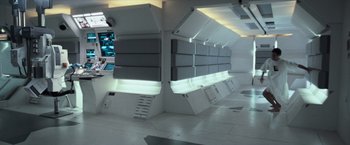 Movie still from “Moon” (2009), directed by Duncan Jones – A room that has a lot of lights on it; Wide shot, High angle