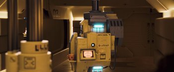 Movie still from “Moon” (2009), directed by Duncan Jones – An image of an electronic device in a room setting; Medium shot, Low angle