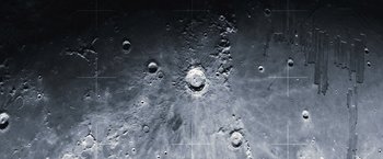 Movie still from “Moon” (2009), directed by Duncan Jones – A view of the moon taken from a telescope; Extreme Close Up shot, Overhead angle