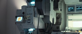 Movie still from “Moon” (2009), directed by Duncan Jones – View of a computer monitor and other electronic equipment; Extreme Close Up shot, Overhead angle