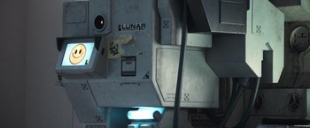 Movie still from “Moon” (2009), directed by Duncan Jones – View of a computer monitor; Extreme Close Up shot, Overhead angle