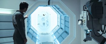 Movie still from “Moon” (2009), directed by Duncan Jones – An overhead view of a room in a space station; Wide shot, Overhead angle