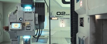 Movie still from “Moon” (2009), directed by Duncan Jones – View of a mirror with a sign on it's side; Extreme Wide shot, Overhead angle