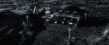 Movie still from “Moon” (2009), directed by Duncan Jones – An aerial view of an area on the moon; Extreme Wide shot, High angle