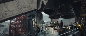 Movie still from “Moonfall” (2022), directed by Roland Emmerich – A group of people standing on top of a platform; Extreme Wide shot, High angle