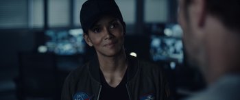Movie still from “Moonfall” (2022), directed by Roland Emmerich – A person wearing a hat; Close Up shot, Over the shoulder angle