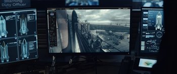 Movie still from “Moonfall” (2022), directed by Roland Emmerich – A computer monitor with a picture of an airport; Extreme Close Up shot, High angle