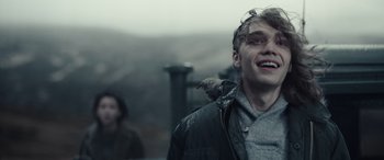 Movie still from “Moonfall” (2022), directed by Roland Emmerich – A man with a bird perched on his shoulder; Close Up shot, Over the shoulder angle