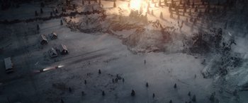 Movie still from “Moonfall” (2022), directed by Roland Emmerich – The sun is setting over a frozen lake; Extreme Wide shot, High angle