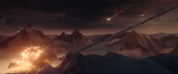 Movie still from “Moonfall” (2022), directed by Roland Emmerich – An image of an asteroid flying through the sky; Extreme Wide shot, Overhead angle