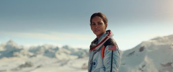 Movie still from “Moonfall” (2022), directed by Roland Emmerich – A woman in a space suit standing in the snow; Medium shot, Low angle