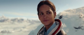 Movie still from “Moonfall” (2022), directed by Roland Emmerich – A person wearing a jacket; Close Up shot, Low angle