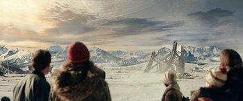 Movie still from “Moonfall” (2022), directed by Roland Emmerich – Two people standing in the middle of a snow covered field; Extreme Wide shot, Over the shoulder angle