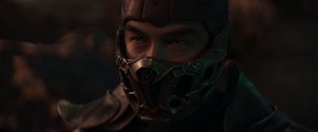 Movie still from “Mortal Kombat” (2021), directed by Simon McQuoid – A person wearing a metal mask; Close Up shot, Low angle