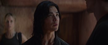 Movie still from “Mortal Kombat” (2021), directed by Simon McQuoid – A person with long black hair; Close Up shot, Low angle