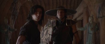 Movie still from “Mortal Kombat” (2021), directed by Simon McQuoid – Two young men standing next to each other; Close Up shot, Low angle
