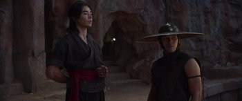 Movie still from “Mortal Kombat” (2021), directed by Simon McQuoid – A man and a woman in traditional japanese garb in a cave; Medium shot, Low angle
