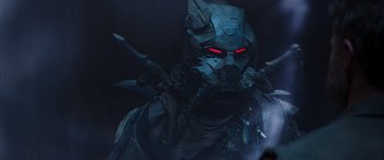 Movie still from “Mortal Kombat” (2021), directed by Simon McQuoid – A person wearing a mask; Medium shot, Low angle