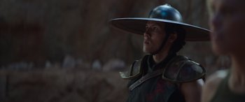Movie still from “Mortal Kombat” (2021), directed by Simon McQuoid – A man wearing a hat and a uniform; Close Up shot, Low angle