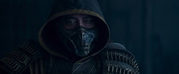 Movie still from “Mortal Kombat” (2021), directed by Simon McQuoid – A man wearing a mask and a helmet; Close Up shot, Low angle