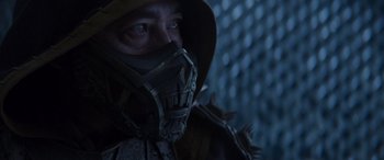 Movie still from “Mortal Kombat” (2021), directed by Simon McQuoid – A man wearing a mask and a hood; Close Up shot, Low angle