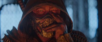 Movie still from “Mortal Kombat” (2021), directed by Simon McQuoid – A person wearing a mask; Close Up shot, Low angle