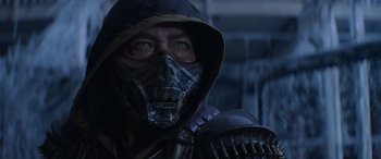 Movie still from “Mortal Kombat” (2021), directed by Simon McQuoid – A man wearing a mask and holding a sword; Close Up shot, Over the shoulder angle
