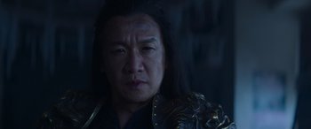 Movie still from “Mortal Kombat” (2021), directed by Simon McQuoid – A person with long black hair; Close Up shot, Low angle