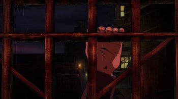 Movie still from “Mortal Kombat Legends: Battle of the Realms” (2021), directed by Ethan Spaulding – A hand is seen through a window of a jail cell; Medium shot, High angle