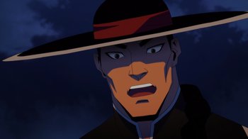 Movie still from “Mortal Kombat Legends: Battle of the Realms” (2021), directed by Ethan Spaulding – A man with a black hat is looking at the camera; Close Up shot, Over the shoulder angle