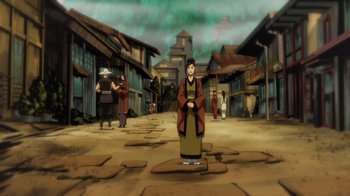 Movie still from “Mortal Kombat Legends: Battle of the Realms” (2021), directed by Ethan Spaulding – An animated scene of a woman standing in the middle of a street; Extreme Wide shot, High angle
