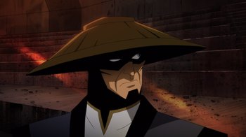 Movie still from “Mortal Kombat Legends: Battle of the Realms” (2021), directed by Ethan Spaulding – A man wearing a hat and a suit in a cartoon; Close Up shot, Over the shoulder angle