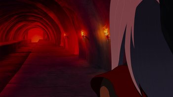 Movie still from “Mortal Kombat Legends: Cage Match” (2023), directed by Ethan Spaulding – A woman in a long red dress in a dark tunnel; Medium shot, Over the shoulder angle