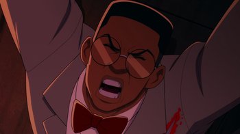 Movie still from “Mortal Kombat Legends: Cage Match” (2023), directed by Ethan Spaulding – An animated man in a suit and bow tie; Extreme Close Up shot, Overhead angle