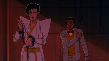 Movie still from “Mortal Kombat Legends: Cage Match” (2023), directed by Ethan Spaulding – Two animated characters are standing next to each other; Medium shot, Low angle