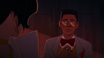 Movie still from “Mortal Kombat Legends: Cage Match” (2023), directed by Ethan Spaulding – An animated man wearing a suit and bow tie; Close Up shot, Over the shoulder angle