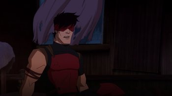 Movie still from “Mortal Kombat Legends: Snow Blind” (2022), directed by Rick Morales – A man in a red and black outfit sitting in front of a window; Medium shot, High angle