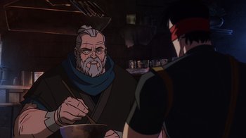 Movie still from “Mortal Kombat Legends: Snow Blind” (2022), directed by Rick Morales – An old man with a bowl of food in front of a young man; Medium shot, Over the shoulder angle