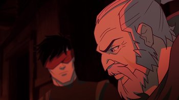 Movie still from “Mortal Kombat Legends: Snow Blind” (2022), directed by Rick Morales – A man with a red beard and a man with a red mask; Close Up shot, Over the shoulder angle