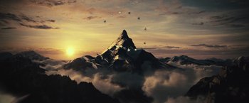 Movie still from “Mother!” (2017), directed by Darren Aronofsky – A mountain with a bunch of stars in the sky above it; Extreme Wide shot, High angle