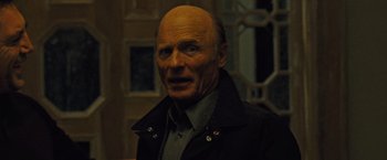 Movie still from “Mother!” (2017), directed by Darren Aronofsky – An older man with a bald head and a beard; Close Up shot, Low angle