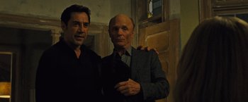 Movie still from “Mother!” (2017), directed by Darren Aronofsky – Two men standing next to each other in front of a door; Medium shot, Low angle