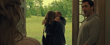 Movie still from “Mother!” (2017), directed by Darren Aronofsky – A man and a woman kissing in front of a window; Medium shot, Over the shoulder angle