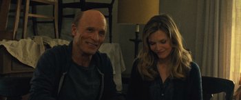 Movie still from “Mother!” (2017), directed by Darren Aronofsky – A man and a woman sitting next to each other in a room; Medium shot, Over the shoulder angle