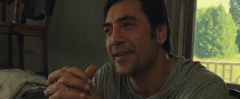 Movie still from “Mother!” (2017), directed by Darren Aronofsky – A person sitting in front of a window; Close Up shot, Over the shoulder angle