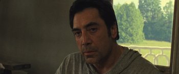 Movie still from “Mother!” (2017), directed by Darren Aronofsky – A person wearing a gray shirt; Close Up shot, Low angle