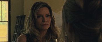 Movie still from “Mother!” (2017), directed by Darren Aronofsky – A woman sitting in front of a mirror holding a glass; Close Up shot, Over the shoulder angle