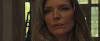 Movie still from “Mother!” (2017), directed by Darren Aronofsky – A woman's face in a dark room; Close Up shot, Over the shoulder angle