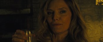 Movie still from “Mother!” (2017), directed by Darren Aronofsky – A person with a glass of wine; Close Up shot, Over the shoulder angle